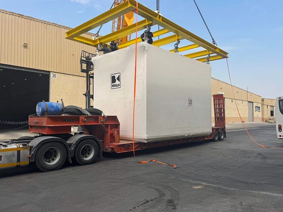 Pre-fabricated module on a lowbed