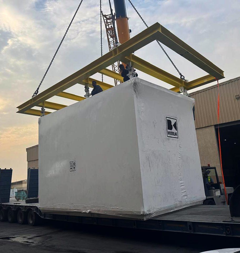 Pre-fabricated module being lifted onto a Redwave Zone lowbed trailer