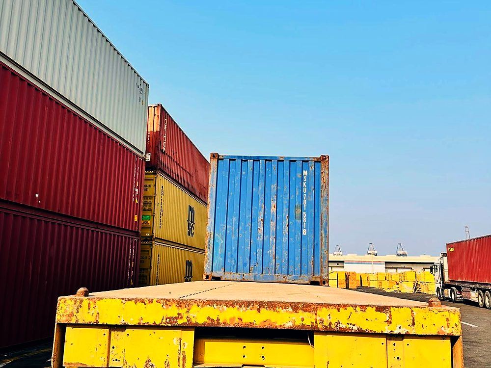 Container loaded on a flatbed trailer