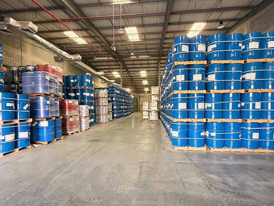 Warehouse aisle with palletised drums